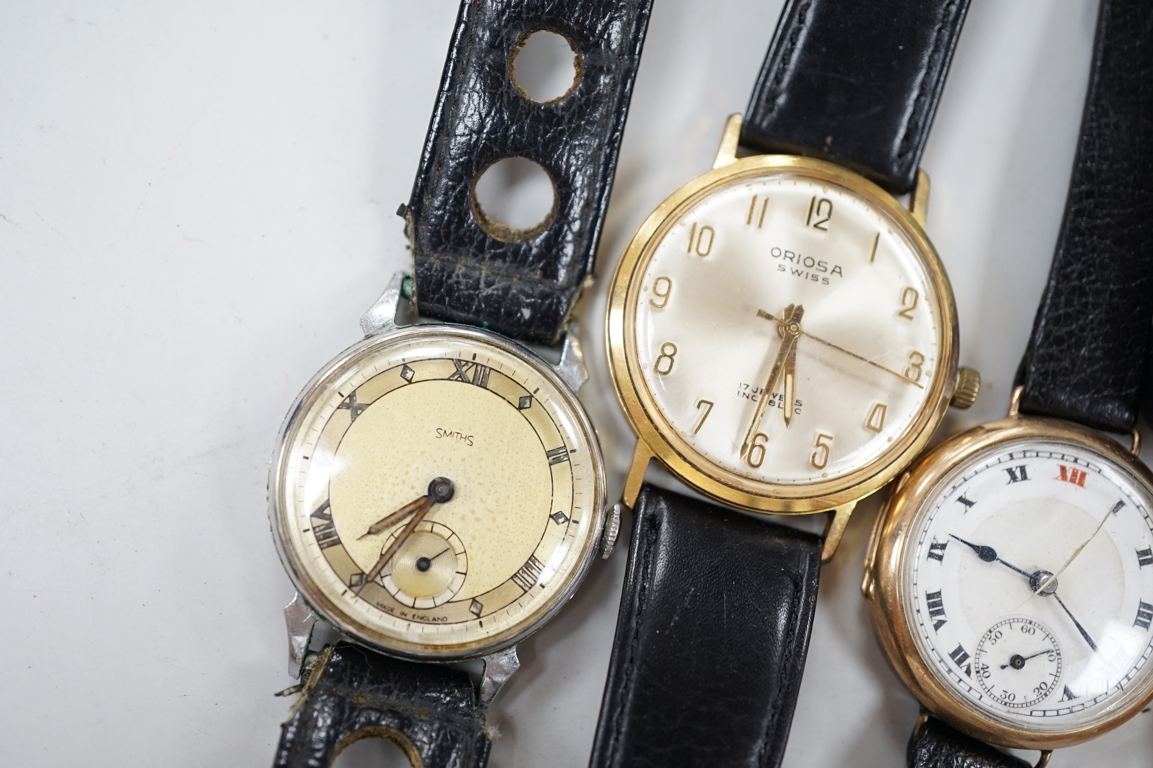 A lady's 1930's 9k J.W. Benson manual wind wrist watch, on a 9ct flexible bracelet, one other gentleman's 9ct gold wrist watch and four other wrist watches.